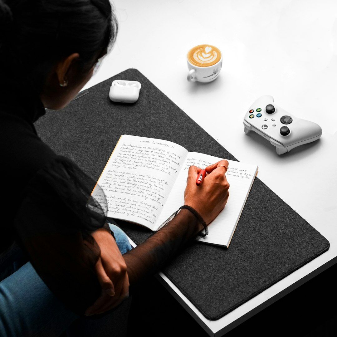 Woman reviewing photo contact sheets at a desk